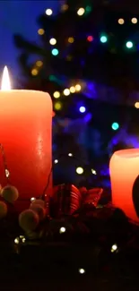 Red candles with holiday bokeh lights create a cozy Christmas ambiance.