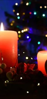 Red candles with holiday lights background.