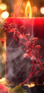 Red candle with berries and glowing festive background.