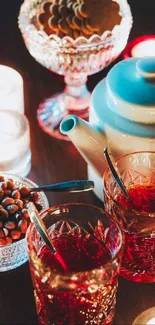 Cozy candlelit scene with tea set and snacks.