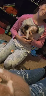 Child playing with kittens on a cozy carpet.