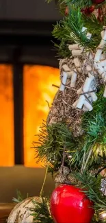 Christmas tree by a glowing fireplace.