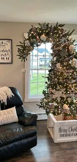 Cozy living room with Christmas tree and festive decor.