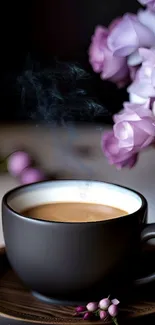 Steaming coffee cup with purple flowers in a cozy setting.