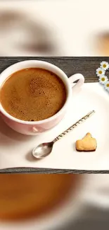 Cup of coffee with a cookie and daisies.