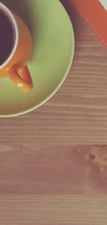 Top view of coffee cup on wooden desk.