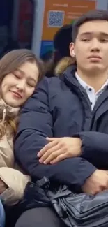 A couple resting on a train during a calm journey.