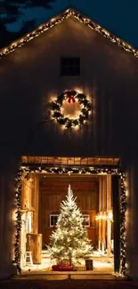 Festive barn with Christmas tree and lights glowing warmly inside and out.