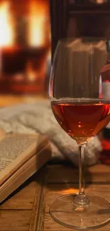 A cozy fireplace with a glass of wine and an open book on a wooden table.