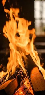 Cozy fireplace flames with burning wood.