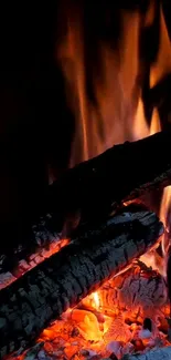 Cozy fireplace wallpaper with glowing embers.