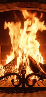 Mobile wallpaper of a cozy fireplace with vibrant, glowing flames and logs.