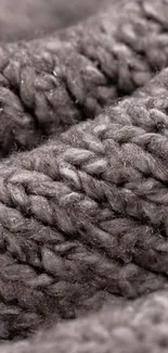 Close-up of grey knitted fabric texture mobile wallpaper.