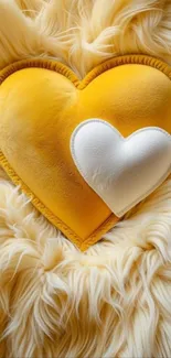 Heart-shaped yellow pillow on fluffy fur.