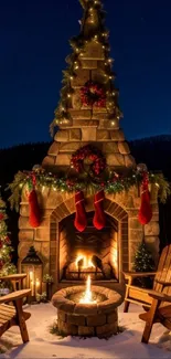 Charming fireplace with Christmas lights and stockings outdoors.