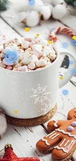 Festive mug of marshmallows and gingerbread on a white table.