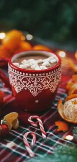 Red mug with hot chocolate and festive decor, perfect for a holiday atmosphere.