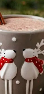 Gray mug with reindeer design and cocoa.