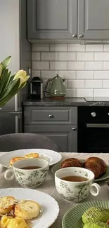 Cozy kitchen table with breakfast and tulips.