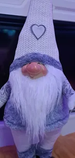 Cozy knitted gnome with heart icon.