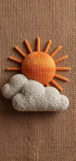 Knitted sun and clouds on brown background.