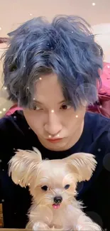 Person with blue hair holding a small fluffy dog in a cozy room.