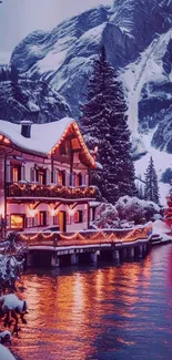 Snow-covered cabin with festive lights by a river.