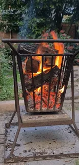 A warm glowing fire pit in a garden setting.