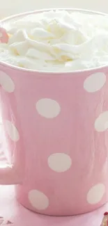 Pink polka dot mug with whipped cream.