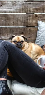 Friends relaxing with coffee and dog in a cozy rustic setting.