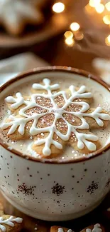 A cozy latte with a snowflake cookie and bokeh lights.