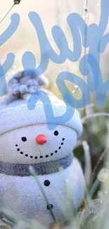 Cozy snowman on frosty grass in a serene winter setting.