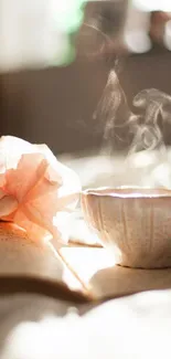 Steaming cup with book and soft floral light in cozy setting.