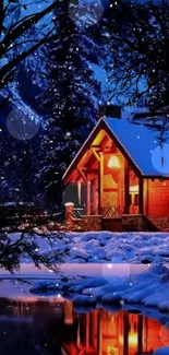 Cozy winter cabin by a snowy lake at night.