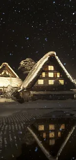 Snowy night view of a cozy, illuminated cottage with reflection.