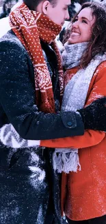 A couple embracing in a snowy winter setting with colorful scarves.