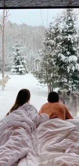 Cozy bed view of a snowy forest with wolves outside.