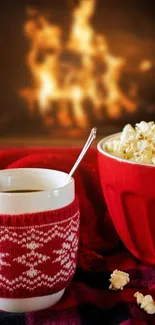 Cozy winter wallpaper with popcorn and coffee by the fire.