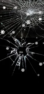 Cracked glass on a black background creating an edgy mobile wallpaper.