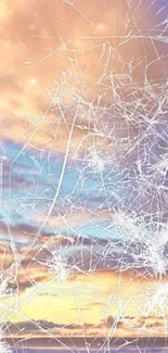 Abstract cracked glass over serene sunset sky wallpaper.