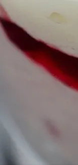 Close-up of a creamy dessert with red accents.