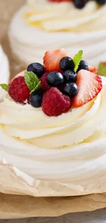 Creamy dessert topped with mixed berries.