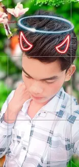 Young man with halo and devil horns filter on green background.