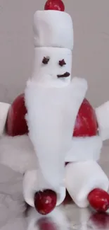 Creative marshmallow Santa with red and white festive design.