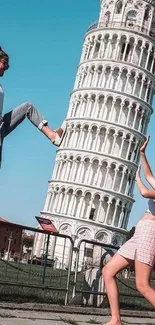 Two people posing creatively with the Leaning Tower of Pisa on a sunny day.