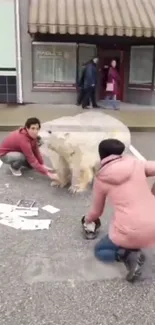 3D painted polar bear emerges on a sidewalk with onlookers around.