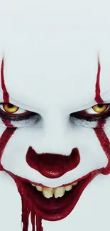 Creepy clown face with red makeup and piercing eyes, perfect for horror themes.