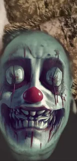 Creepy clown face with red nose and eerie details wallpaper.