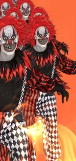 Creepy clowns with red hair on a fiery orange background.