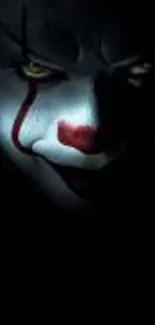 Creepy clown face with dark eerie background.